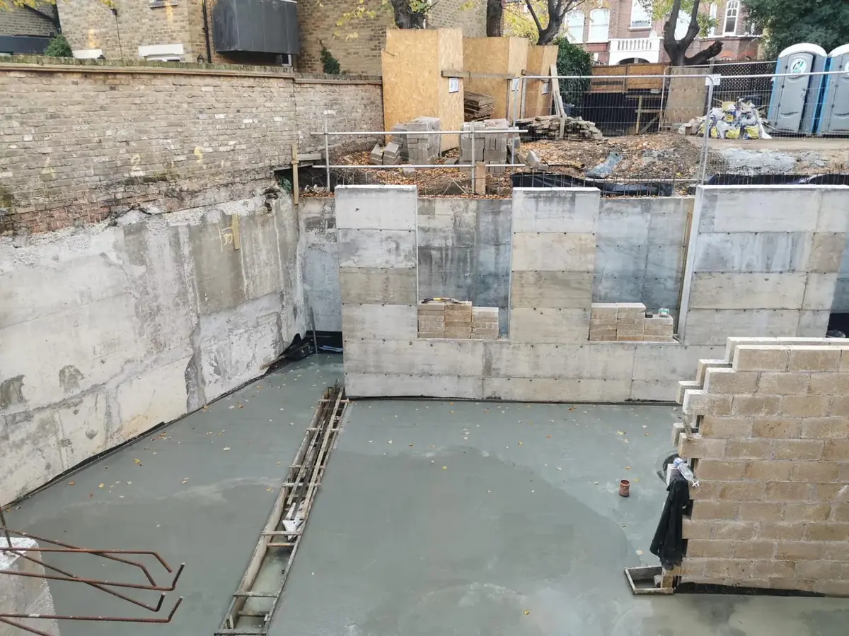 Basement slab and retaining walls